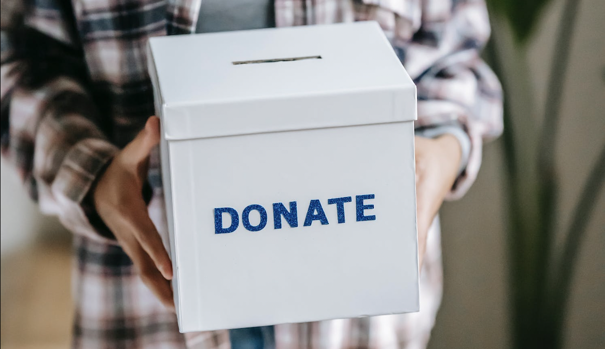 How can charities recognise the value of donated goods in their records